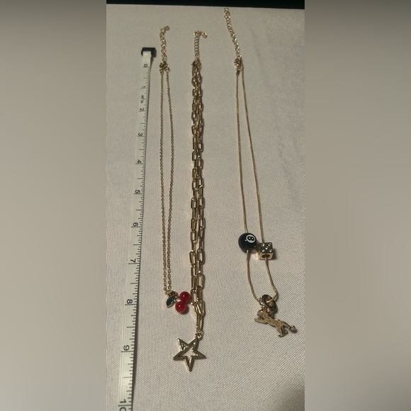 Gold-Tone Layered Charm Necklace Set with Star, Cherry, and 8-Ball Accents - Picture 3 of 4